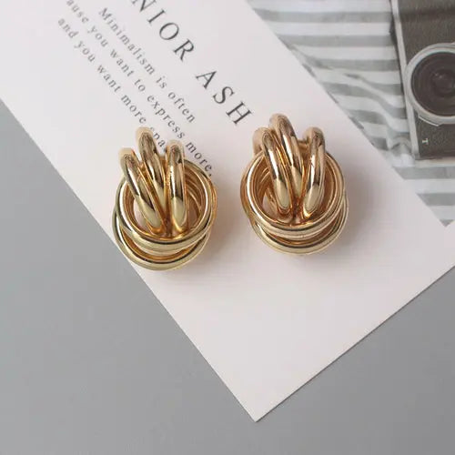 OH Fashion Twist Metal Stud Earrings for Women Hollow Geometric
